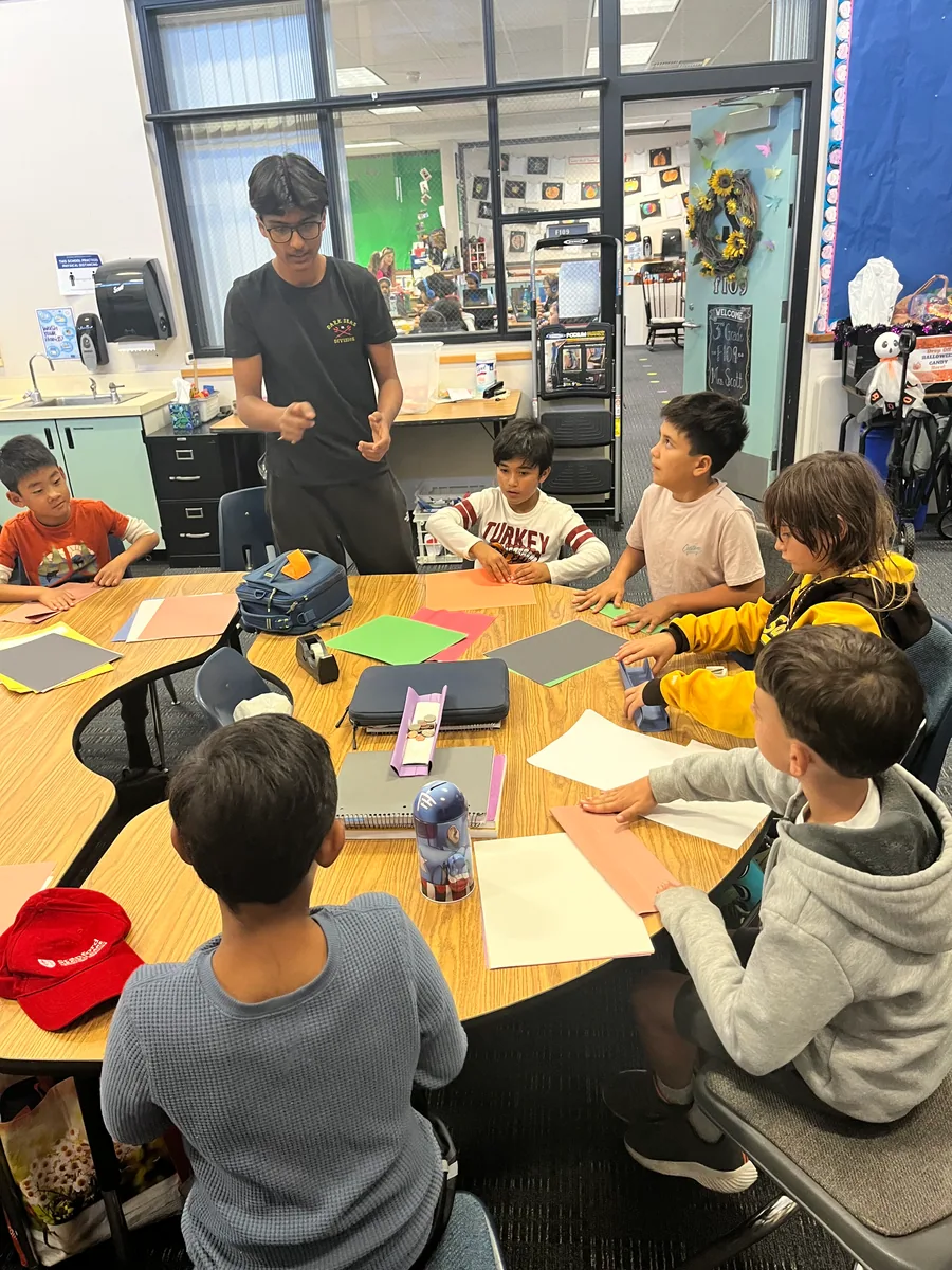 A volunteer leading a classroom activity