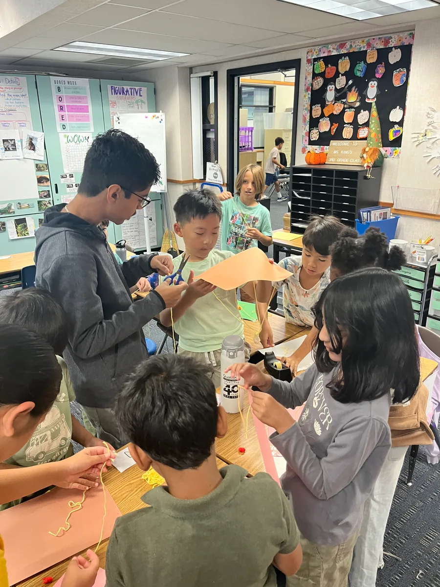 Students working together on a hands-on engineering activity
